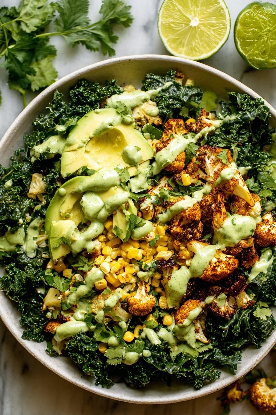 Roasted Cauliflower Green Goddess Salad, roasted cauliflower salad, green goddess dressing recipe, healthy savory salad, colorful roasted vegetable salad - A white bowl holds a fresh salad with three main layers: the base layer is dark green curly kale leaves, rough in texture and filling the bowl. On top, there are golden brown roasted cauliflower pieces and small yellow corn kernels scattered around, adding a slightly crunchy texture. The top layer features light green avocado slices arranged evenly across the salad, covered with a creamy green sauce drizzled in thick dollops. The salad is on a white marbled surface with a halved lime and some green herbs nearby. photo taken with an iphone --ar 2:3 --v 7