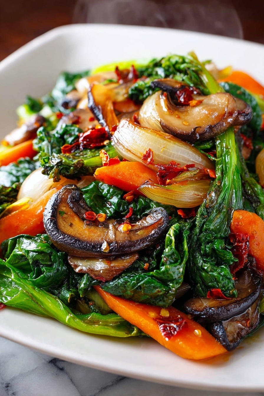 Healthy Sautéed Vegetables, quick vegetable side dish, nutritious vegetable recipes, easy sautéed veggie recipes, colorful vegetable sides - A close-up view of a white square plate filled with stir-fried vegetables, showing a mix of three main layers: the base layer has bright green leafy greens with a slightly shiny texture, the middle layer contains sliced orange carrots and browned onion pieces with a soft texture, and the top layer features sautéed brown mushrooms with some charred edges and small red chili flakes scattered throughout. The vegetables look hot with a faint steam rising in the background, and the plate rests on a white marbled surface. photo taken with an iphone --ar 2:3 --v 7